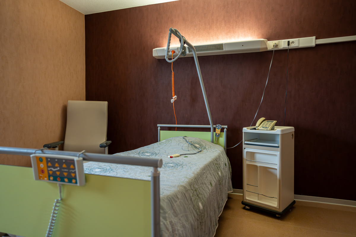 Modern hospital room with bed and equipment